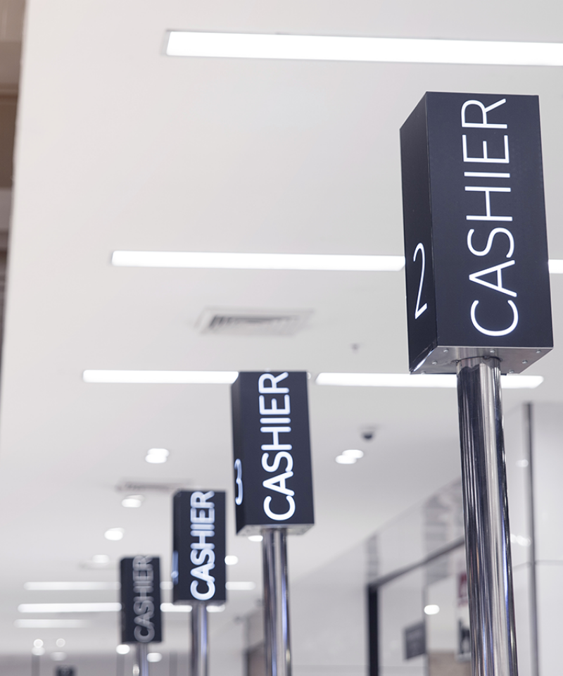 Cashier poles at checkout counter
